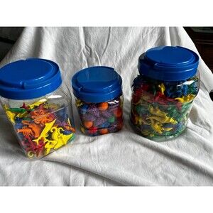 plastic fidget dinosaurs, fruit and sea creatures in plastic jars